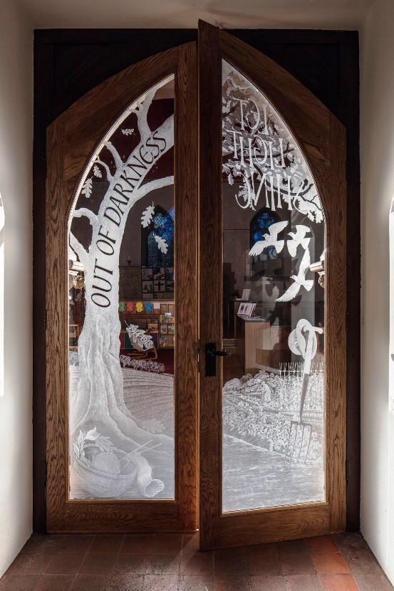 A pair of doors for All Saints, Croxley Green engraved to mark the sacrifices, hardships and bravery of those left at home during the first world war.______Image by Nick Carter